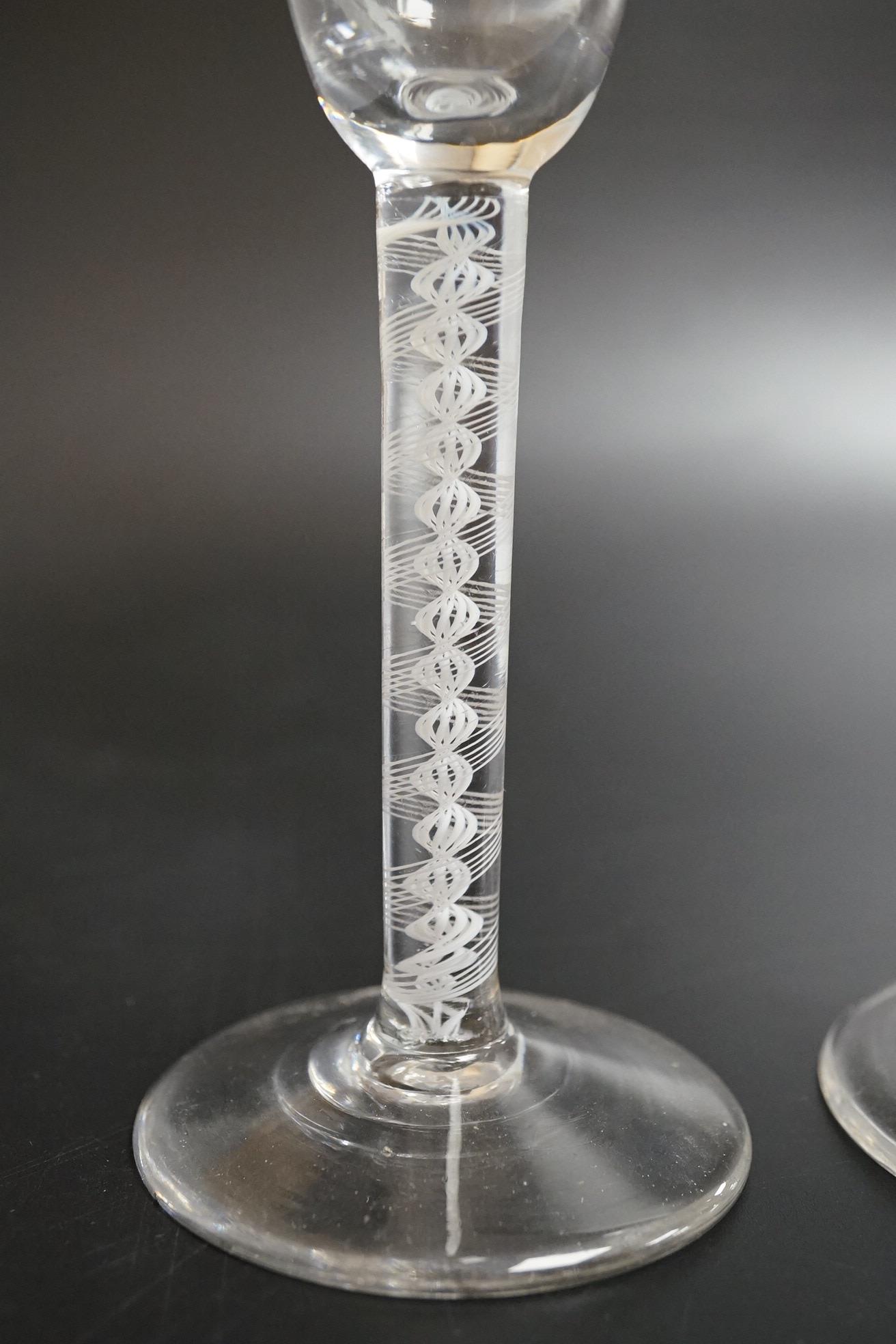 Two DSOT stem wine glasses, c.1760, with funnel shaped bowls, tallest 16.5cm high